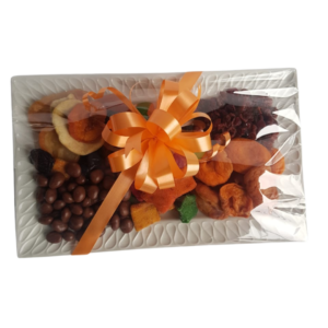 Snack Platter - Choc Raisins, Sugar Lollies, Drywors, Peaches, dried Fruit & Peanuts on a Glass Plate